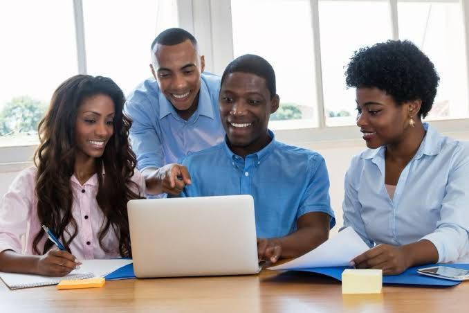 A workplace team collaborating around a table